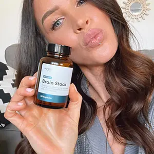 Woman-Holding-Brain-Stack-Psilocybin-Mushroom-Microdose-Supplement3