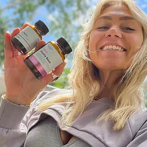 Woman-Holding-Vitality-Stack-Psilocybin-Mushroom-Microdose-Supplement